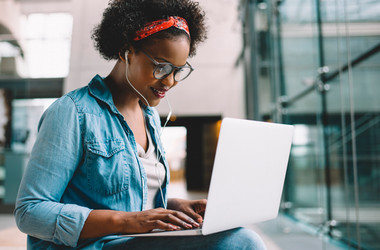 woman looking at her laptop