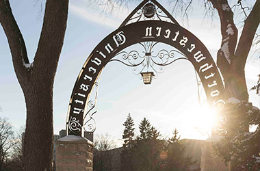 Image of the back side of Weber arch during a winter sunset