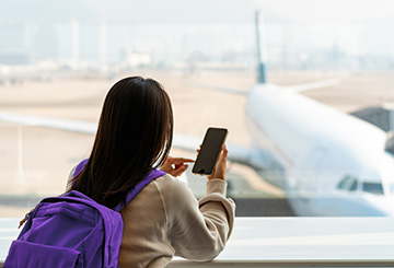 Person on their phone at the airport